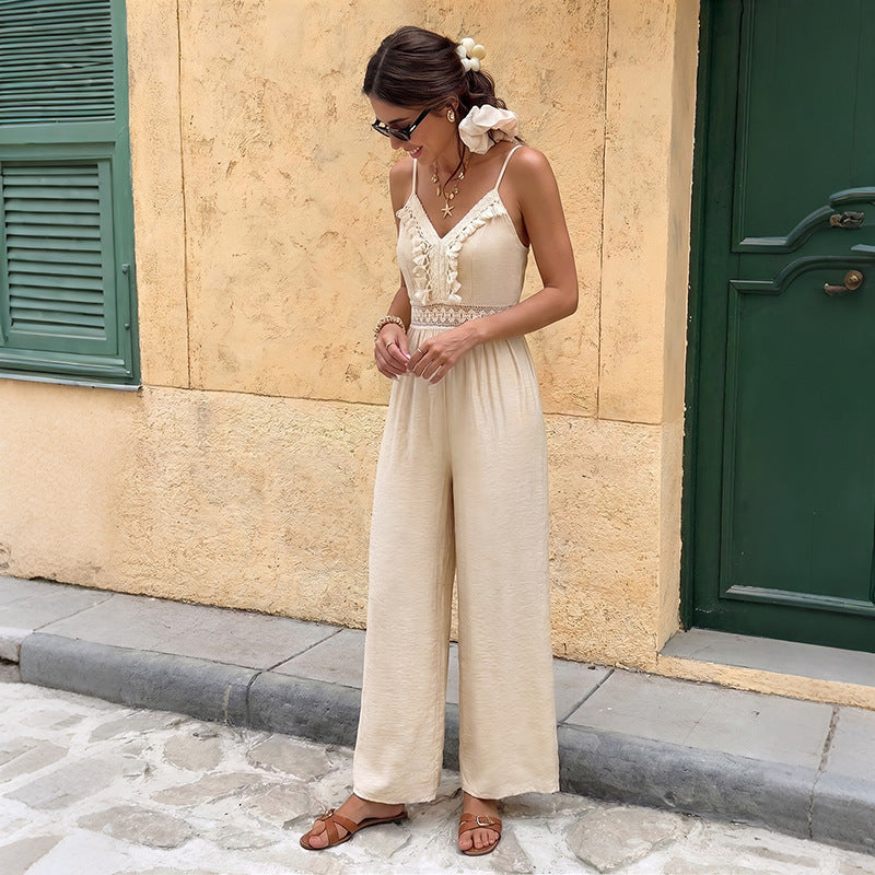 Combinaison pantalon long en dentelle unie douce au toucher, ornée de pompons et de bretelles côtelées
