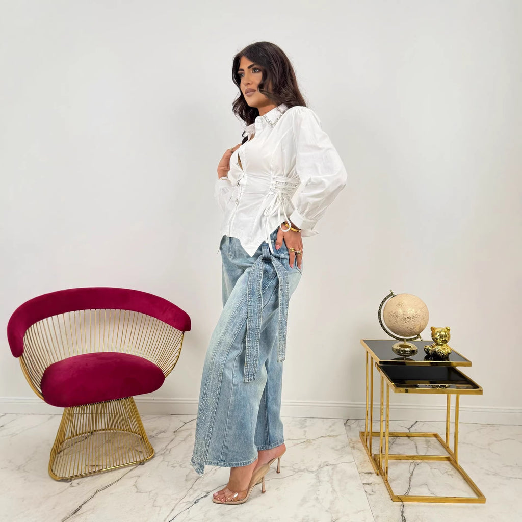 Pantalon en jean délavé tendance orné d'un nœud latéral en strass