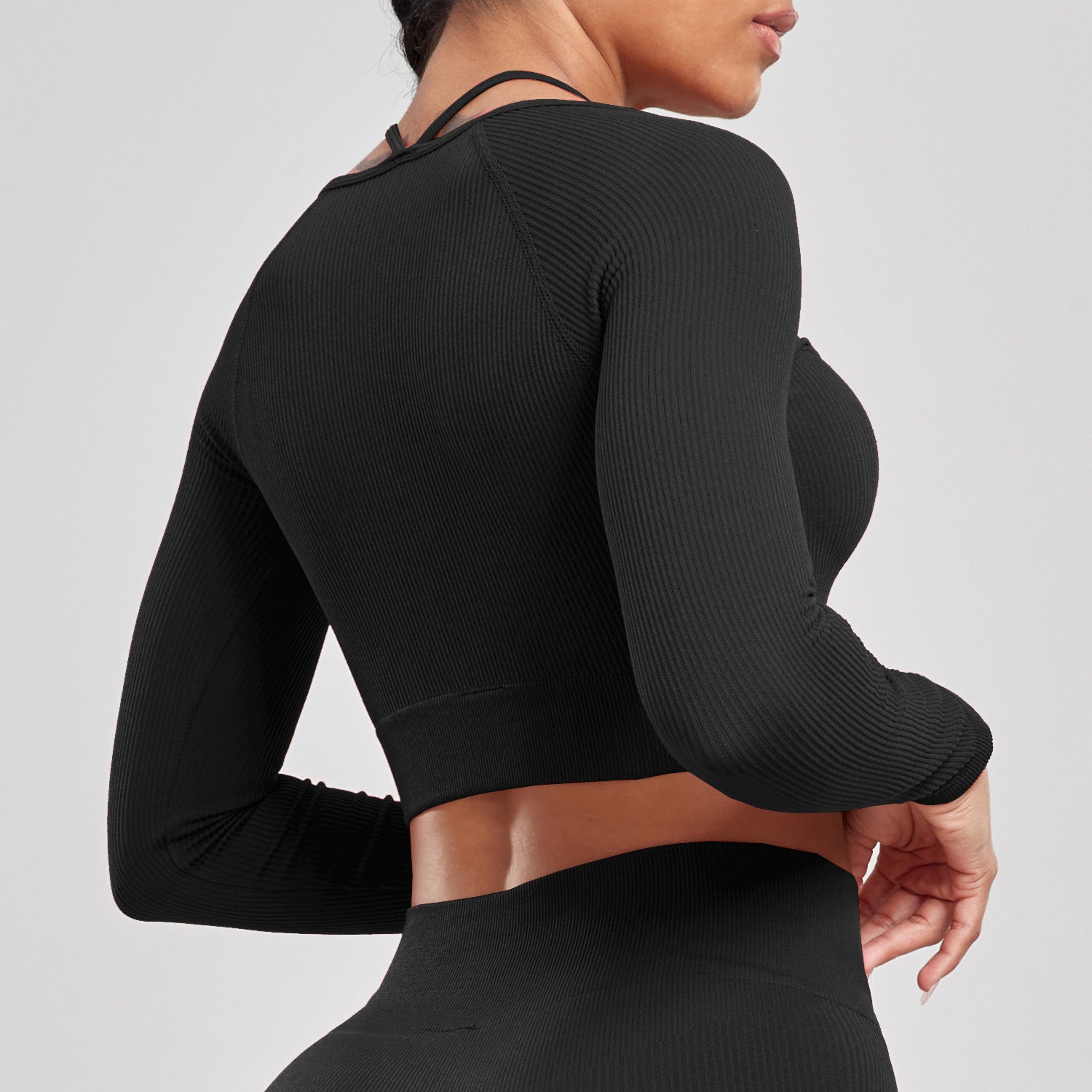 Ensemble de sport pour la course à pied, le yoga et le fitness, composé d'un t-shirt moulant taille haute dos nu et sans coutures côtelé à manches longues et de vêtements de sport à séchage rapide.