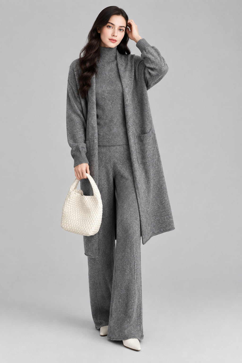 Ensemble trois pièces : gilet intérieur uni, gilet extérieur mi-long et pantalon large taille haute.