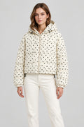Manteau court à pois et manches longues