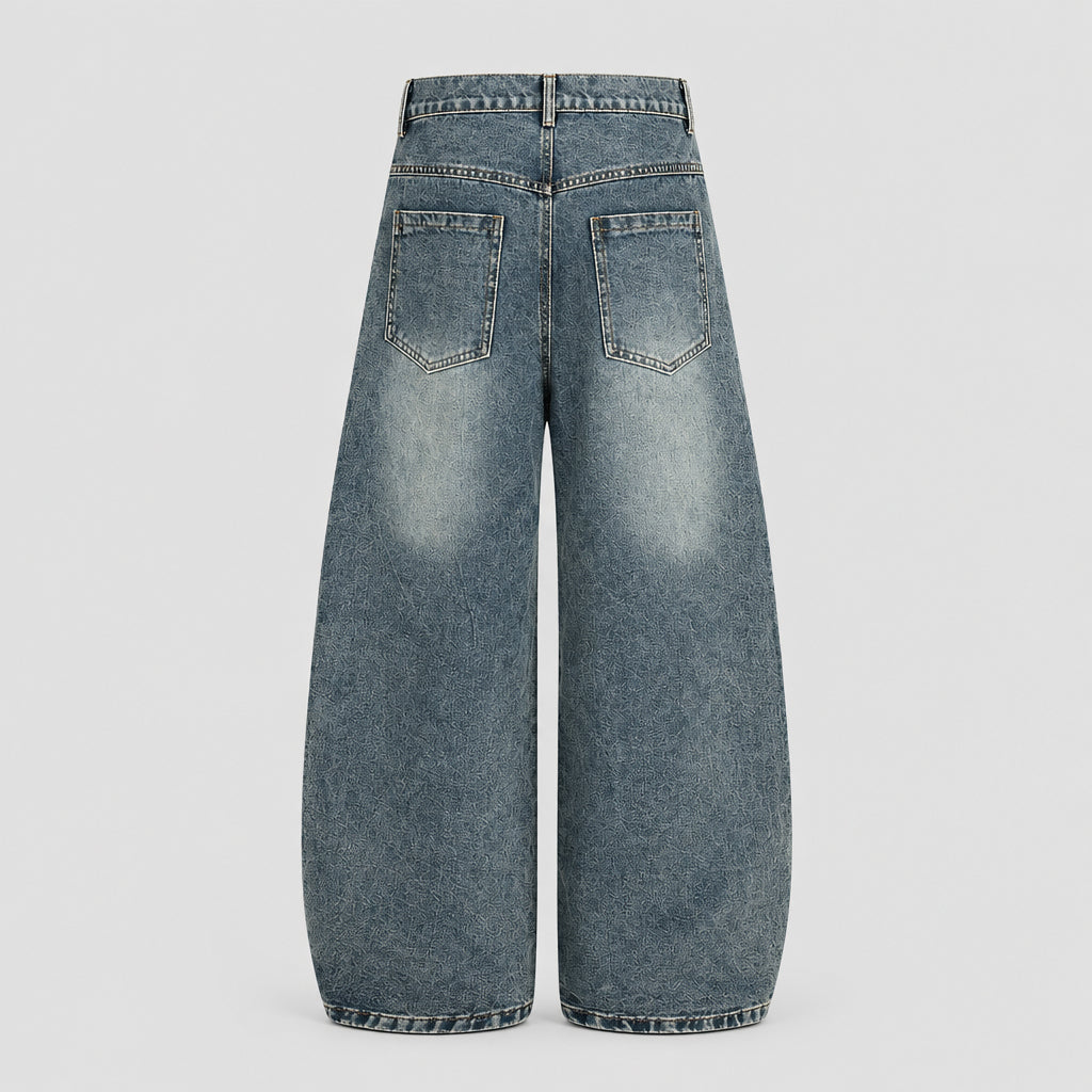 Pantalon en denim délavé à découpes incurvées