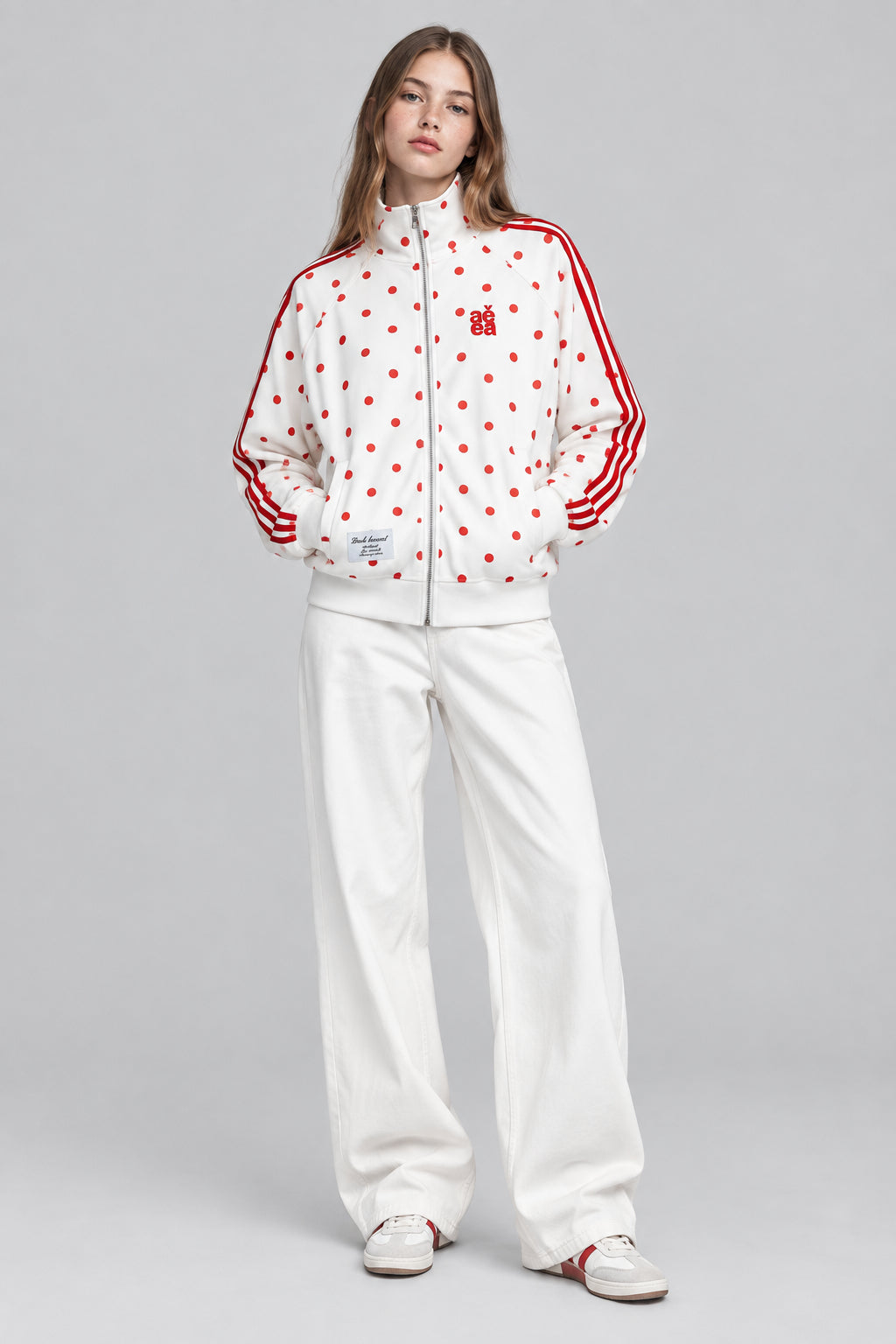 Gilet  à motif pois intégral, col montant et fermeture zippée