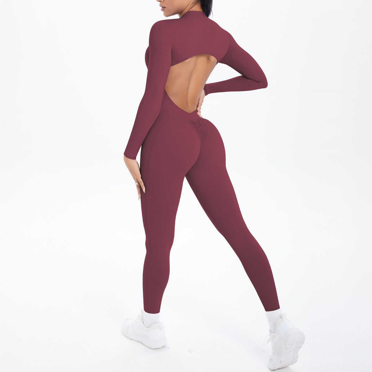 Combinaison de yoga style demi-zip, coupe ajustée effet seconde peau, manches longues et pantalon long, tenue de yoga très élastique.
