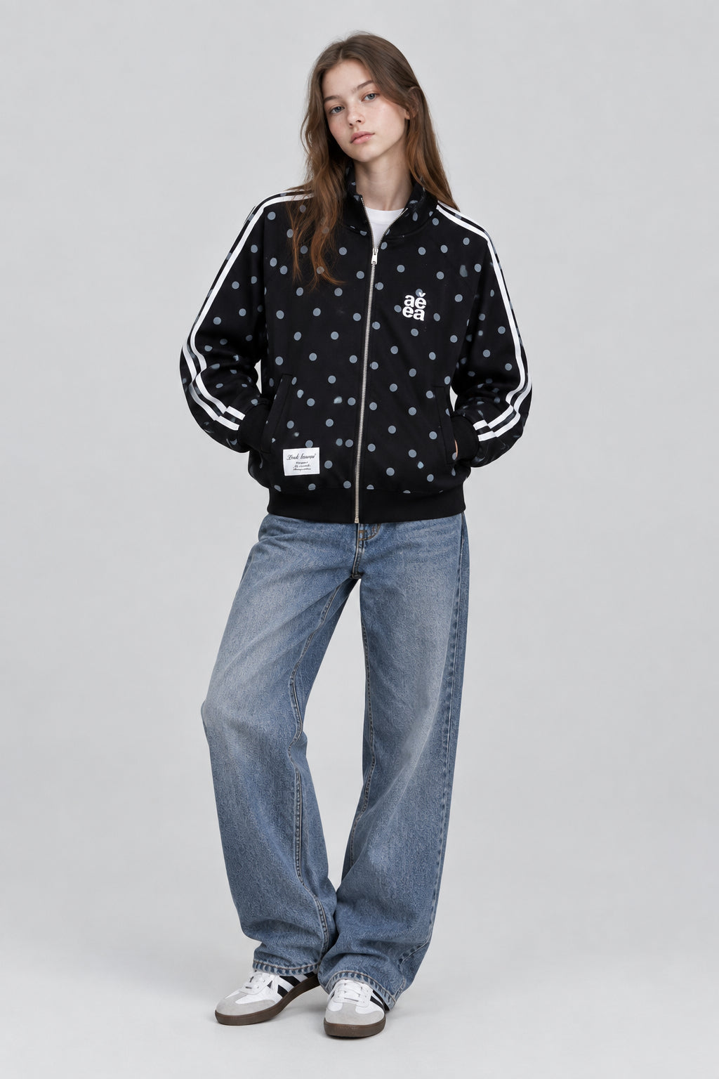 Gilet  à motif pois intégral, col montant et fermeture zippée