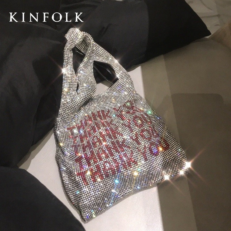 Sac à main à main avec strass et incrustations de diamants
