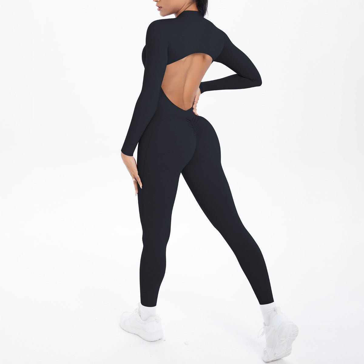 Combinaison de yoga style demi-zip, coupe ajustée effet seconde peau, manches longues et pantalon long, tenue de yoga très élastique.