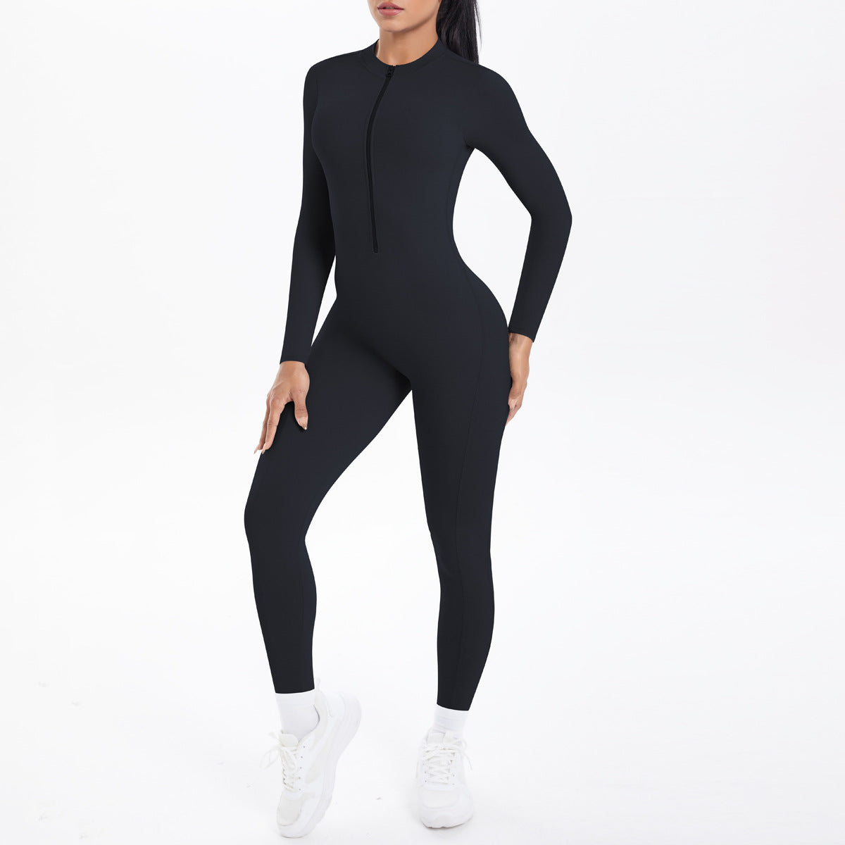 Combinaison de yoga style demi-zip, coupe ajustée effet seconde peau, manches longues et pantalon long, tenue de yoga très élastique.