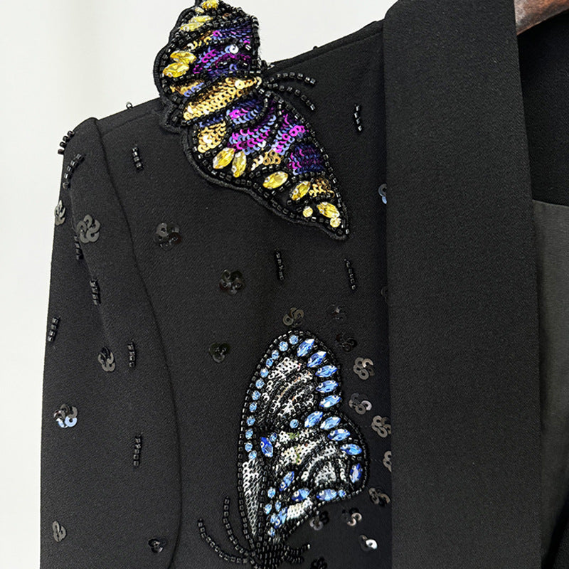Ensemble  : Pantalon et haut ornés de motifs papillons en relief, de perles et de strass.