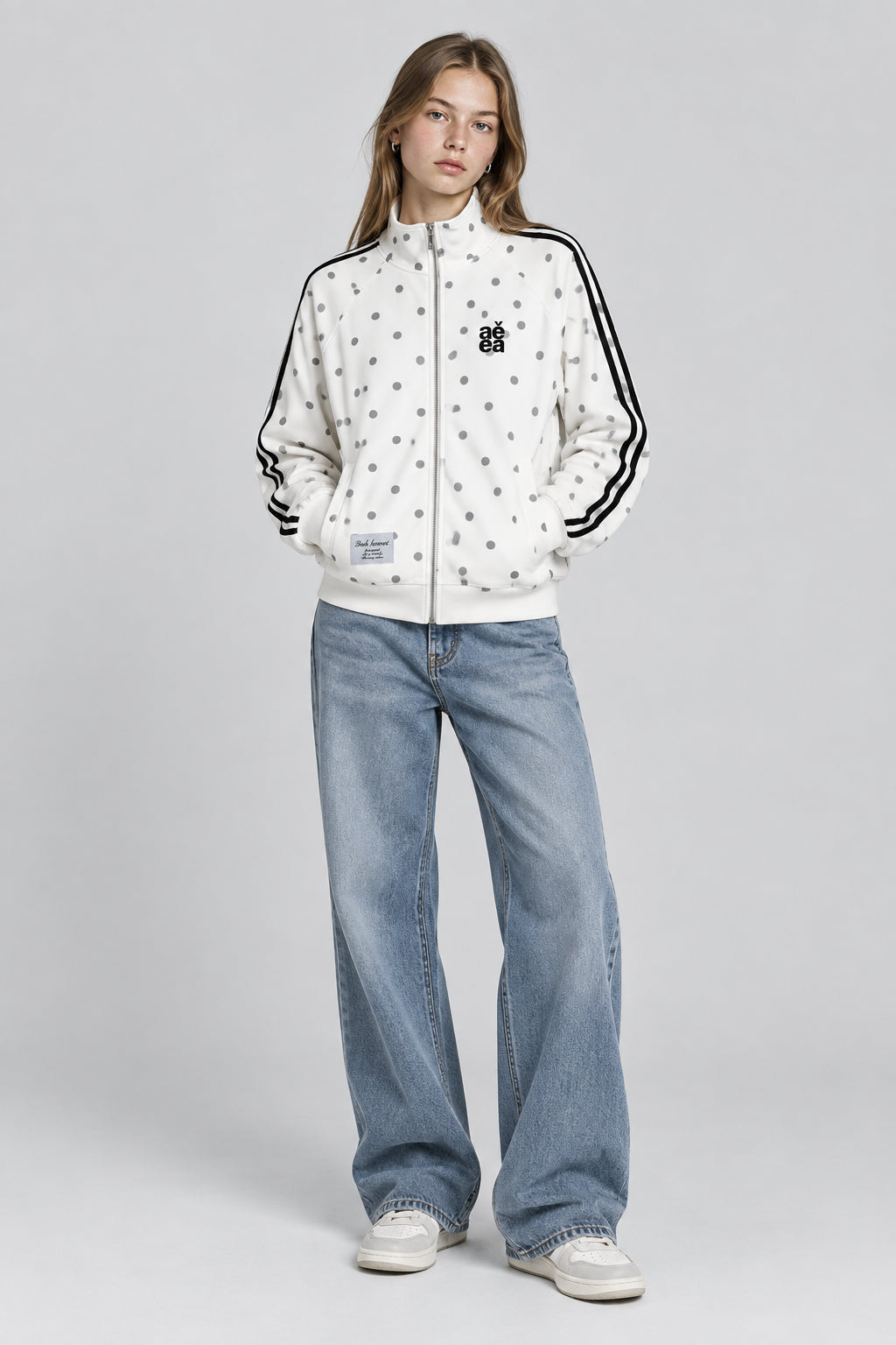 Gilet  à motif pois intégral, col montant et fermeture zippée