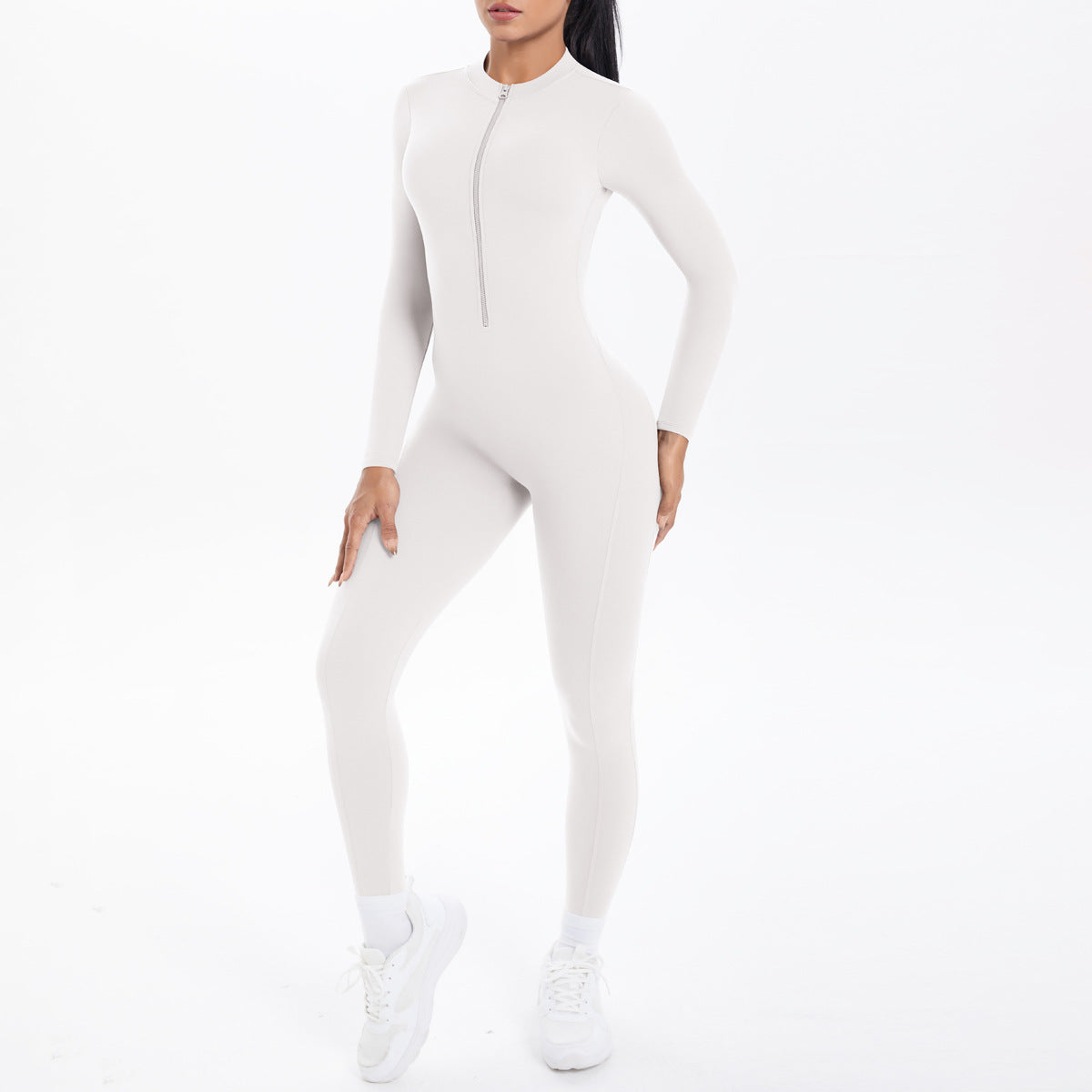 Combinaison de yoga style demi-zip, coupe ajustée effet seconde peau, manches longues et pantalon long, tenue de yoga très élastique.