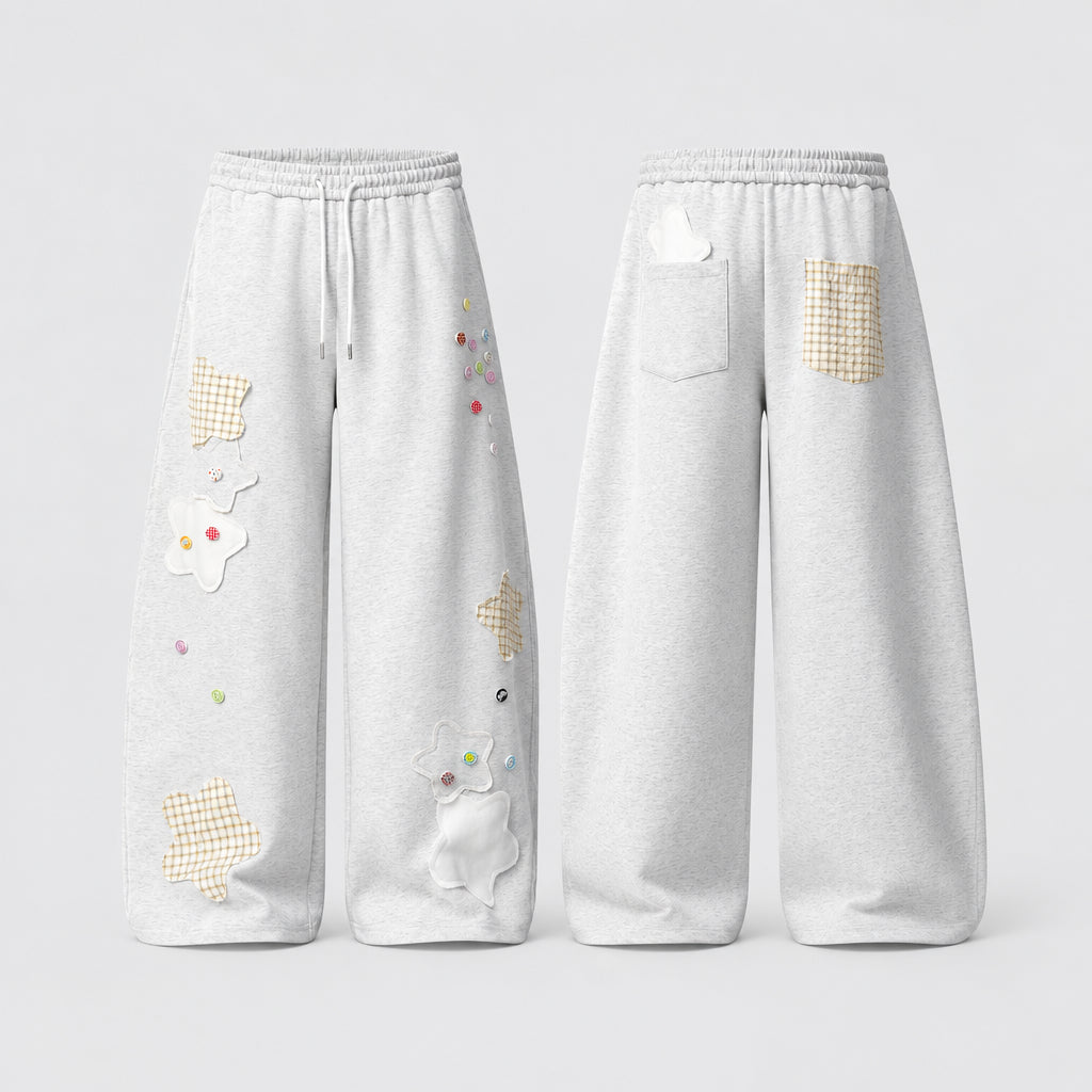Pantalon de jogging ample  pour femme, style streetwear, coupe large, poches cargo et broderies.