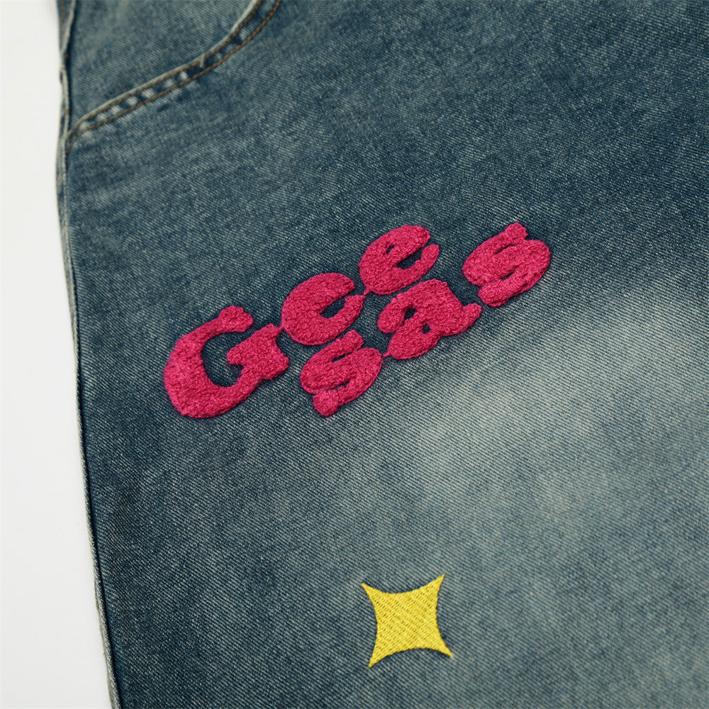 Pantalon en denim délavé à découpes incurvées